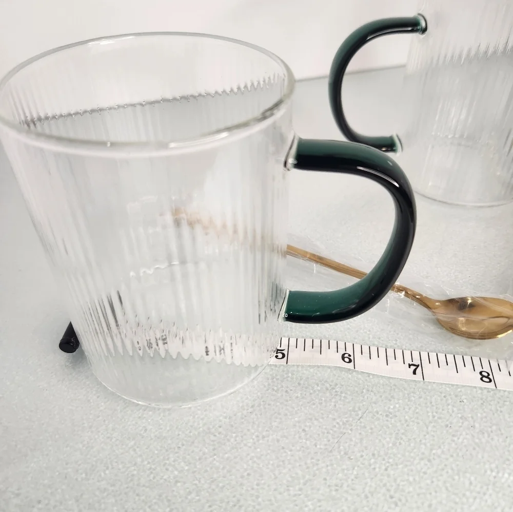 Lot 2 heat resistant clear and green‎ glass coffee/tea cups w gold stir spoons